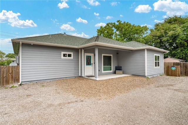 230 Valerie St, Corpus Christi, TX 78418 - back of house with a patio, fence, and a shingled roof