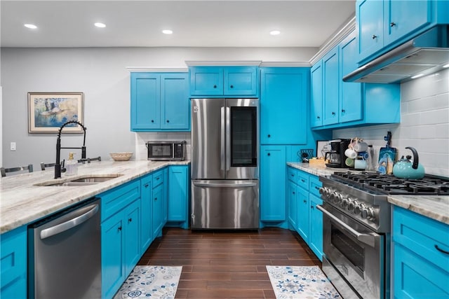 230 Valerie St, Corpus Christi, TX 78418 - kitchen featuring appliances with stainless steel finishes, a sink, blue cabinets, and recessed lighting