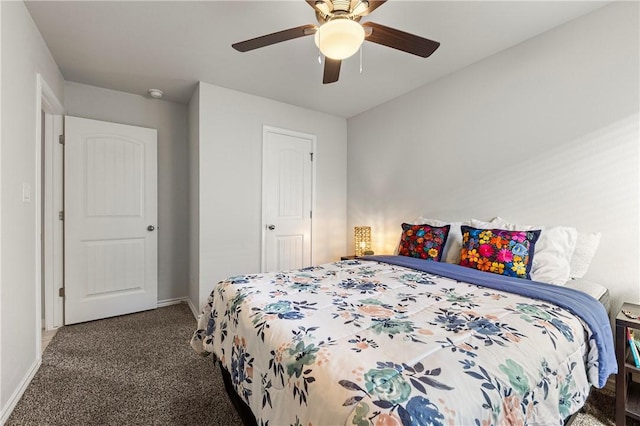 bedroom with ceiling fan and dark colored carpet