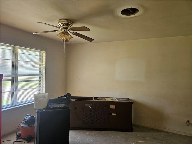 909 Johnson St, Woodsboro, TX 78393 - office featuring a ceiling fan and concrete floors