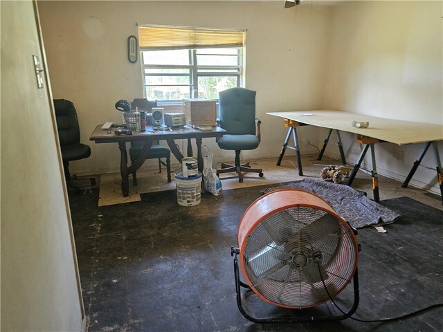 909 Johnson St, Woodsboro, TX 78393 - home office featuring concrete flooring