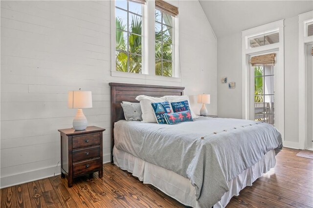 104 Still Water Dr, Port Aransas, TX 78373 - bedroom with lofted ceiling and wood finished floors