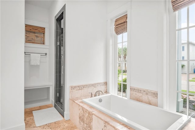 104 Still Water Dr, Port Aransas, TX 78373 - bathroom with healthy amount of natural light and a garden tub
