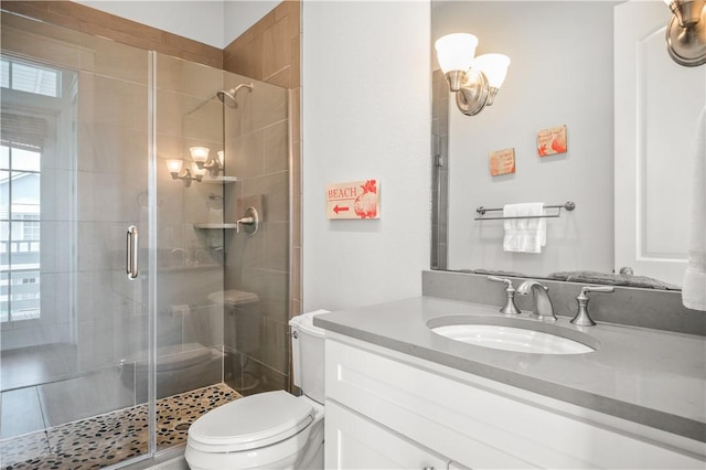 104 Still Water Dr, Port Aransas, TX 78373 - full bathroom featuring a chandelier, a stall shower, toilet, and vanity