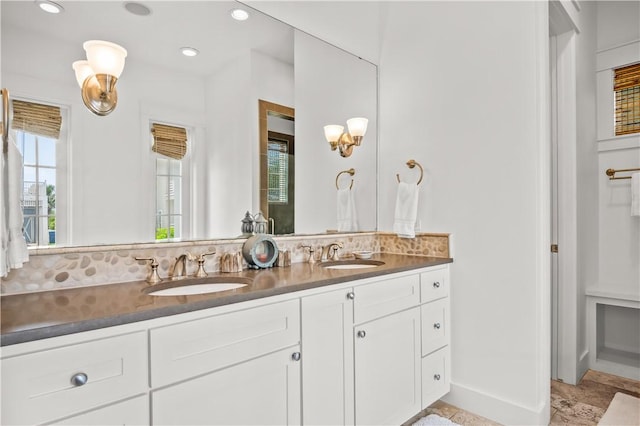 104 Still Water Dr, Port Aransas, TX 78373 - bathroom featuring double vanity, tasteful backsplash, recessed lighting, and baseboards