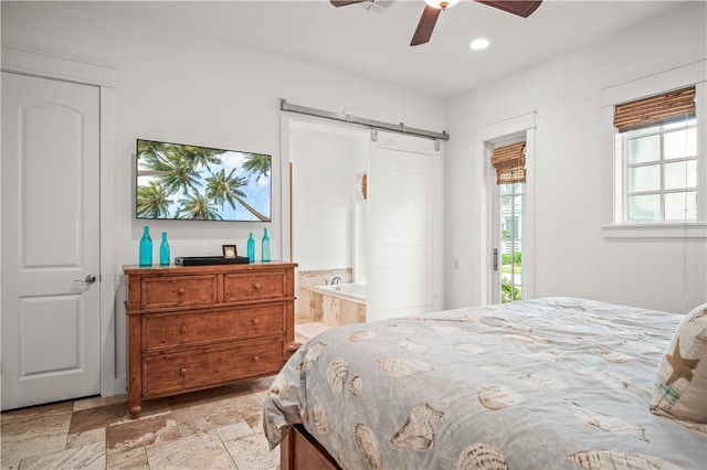 104 Still Water Dr, Port Aransas, TX 78373 - bedroom featuring a barn door, access to exterior, stone tile flooring, recessed lighting, and a ceiling fan