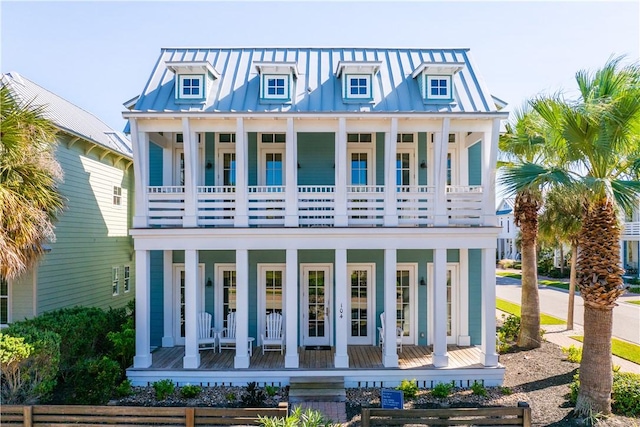 104 Still Water Dr, Port Aransas, TX 78373 - rear view of property featuring covered porch, a balcony, metal roof, and a standing seam roof