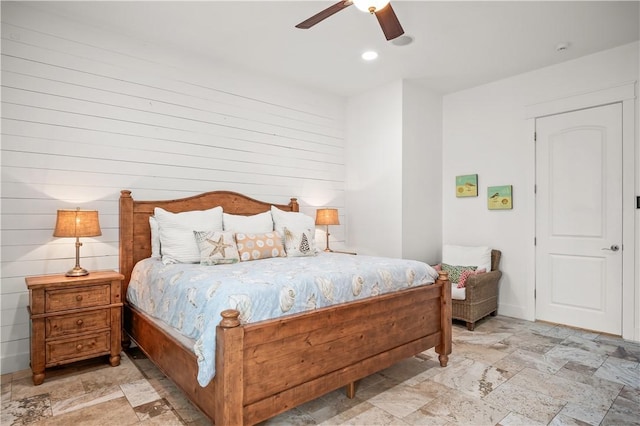 104 Still Water Dr, Port Aransas, TX 78373 - bedroom featuring stone tile flooring, a ceiling fan, and recessed lighting