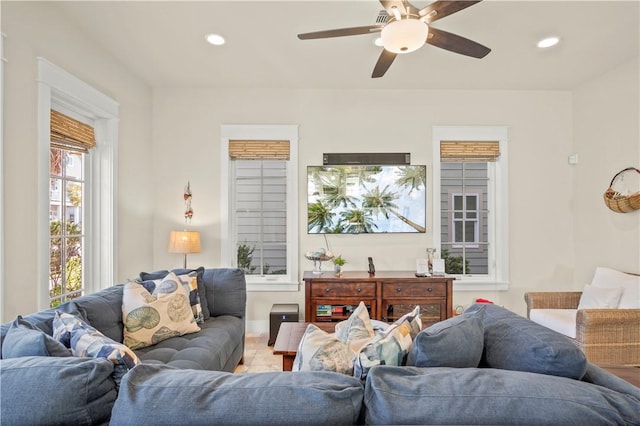 living room with tile patterned floors and ceiling fan