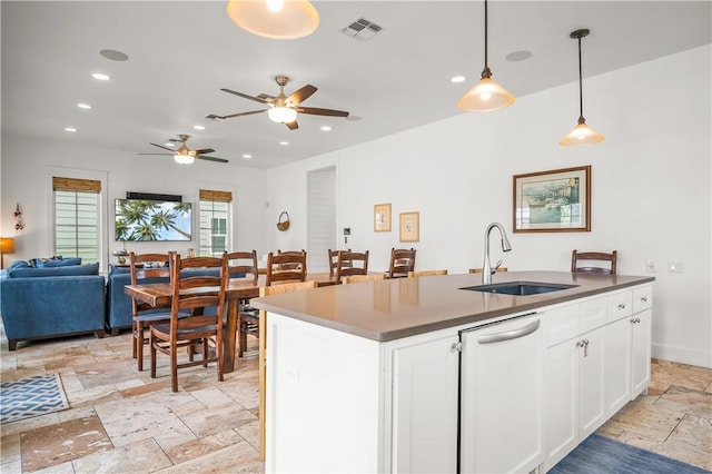 104 Still Water Dr, Port Aransas, TX 78373 - kitchen featuring a sink, white dishwasher, open floor plan, stone tile floors, and ceiling fan