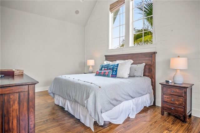 104 Still Water Dr, Port Aransas, TX 78373 - bedroom with hardwood / wood-style floors and lofted ceiling