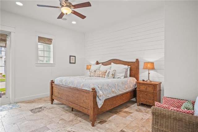104 Still Water Dr, Port Aransas, TX 78373 - bedroom featuring stone tile flooring, access to exterior, recessed lighting, ceiling fan, and baseboards