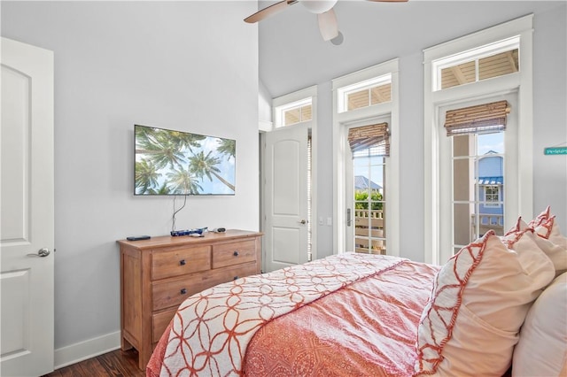 bedroom with access to outside, ceiling fan, and dark hardwood / wood-style flooring