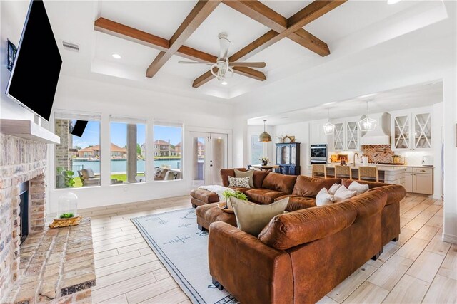 14933 Lake Mead, Robstown, TX 78380 - living room featuring coffered ceiling, a fireplace, ceiling fan, recessed lighting, and beam ceiling