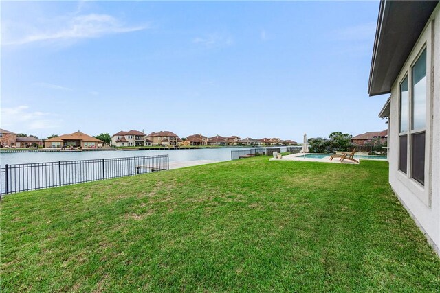 14933 Lake Mead, Robstown, TX 78380 - view of yard with a residential view and a water view