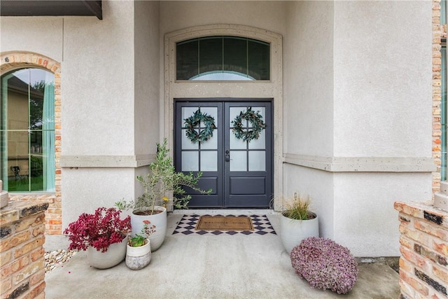 14933 Lake Mead, Robstown, TX 78380 - property entrance with french doors, stucco siding, and stone siding