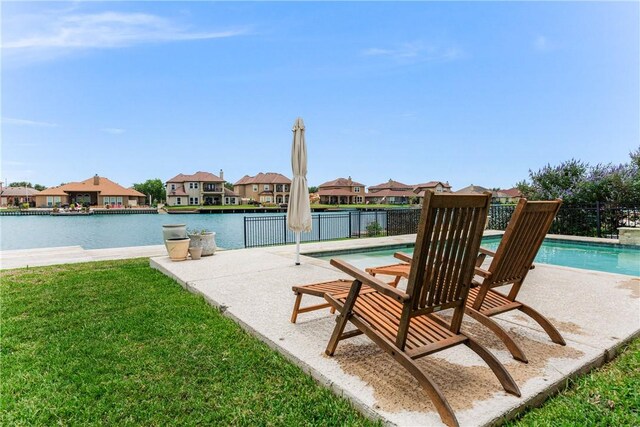 14933 Lake Mead, Robstown, TX 78380 - view of swimming pool with a residential view, a patio area, and a water view