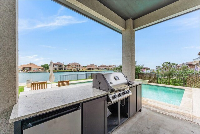 14933 Lake Mead, Robstown, TX 78380 - view of patio / terrace with area for grilling, a fenced backyard, a residential view, and a water view