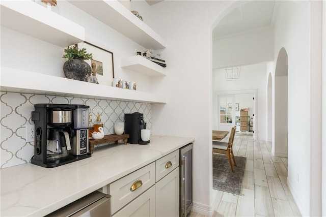 14933 Lake Mead, Robstown, TX 78380 - bar area with wine cooler, arched walkways, tasteful backsplash, and baseboards