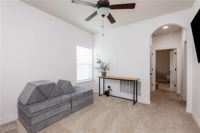 14933 Lake Mead, Robstown, TX 78380 - sitting room with arched walkways, carpet, and ceiling fan