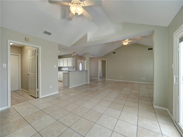 unfurnished living room with lofted ceiling, light tile patterned flooring, and ceiling fan