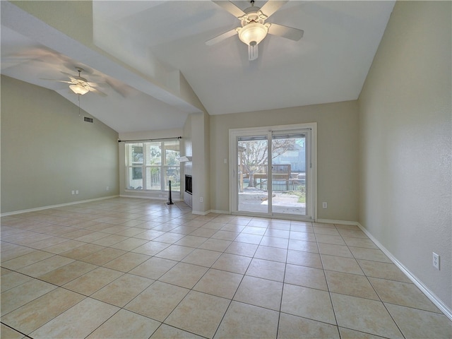 empty room with light tile patterned floors, ceiling fan, and lofted ceiling