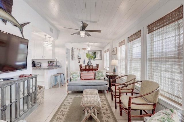 4034 Laguna Shores Rd, Corpus Christi, TX 78418 - living room with light tile patterned floors, wooden ceiling, visible vents, and a ceiling fan