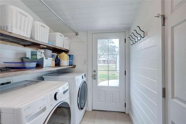 4034 Laguna Shores Rd, Corpus Christi, TX 78418 - clothes washing area featuring laundry area, light tile patterned floors, and separate washer and dryer
