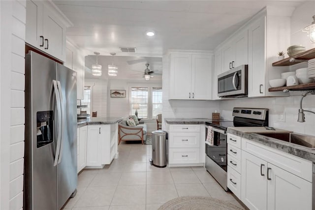 4034 Laguna Shores Rd, Corpus Christi, TX 78418 - kitchen featuring open shelves, appliances with stainless steel finishes, white cabinets, and a sink