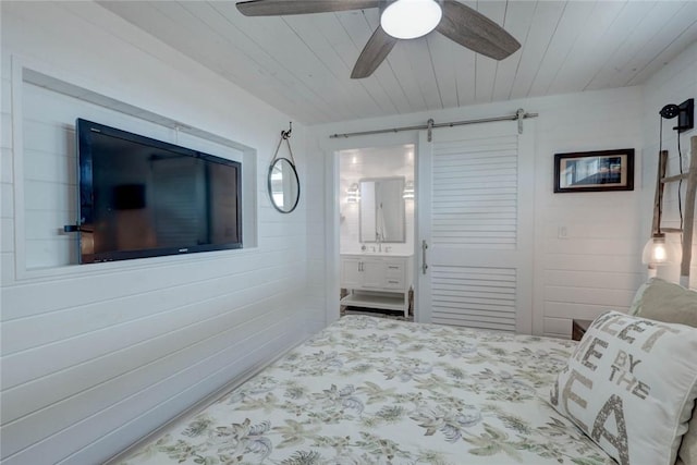 4034 Laguna Shores Rd, Corpus Christi, TX 78418 - bedroom featuring a ceiling fan, wood ceiling, ensuite bathroom, and a barn door