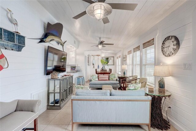 4034 Laguna Shores Rd, Corpus Christi, TX 78418 - living room featuring light tile patterned floors, ceiling fan, wood walls, and wood ceiling
