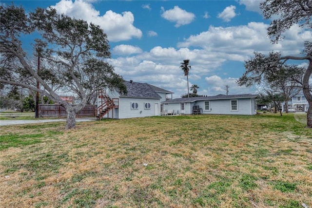 4034 Laguna Shores Rd, Corpus Christi, TX 78418 - view of yard with stairway and fence