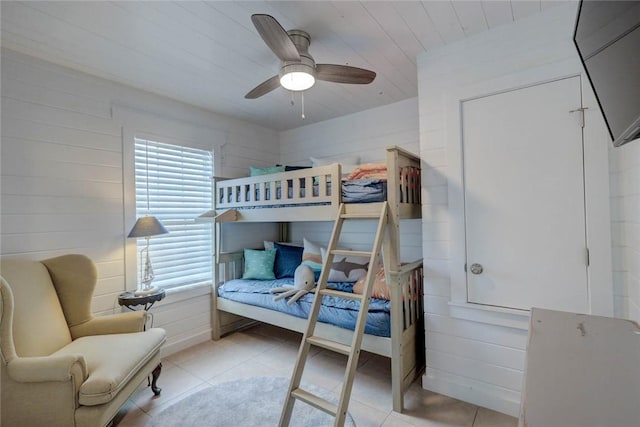 4034 Laguna Shores Rd, Corpus Christi, TX 78418 - bedroom featuring wood ceiling, ceiling fan, wooden walls, and light tile patterned floors