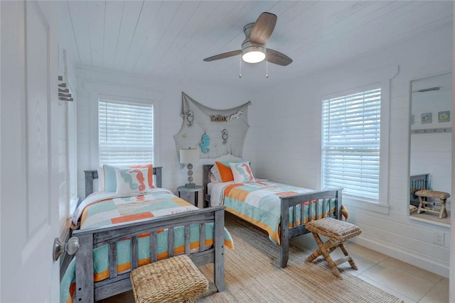 4034 Laguna Shores Rd, Corpus Christi, TX 78418 - bedroom with multiple windows, light tile patterned flooring, wood ceiling, and a ceiling fan