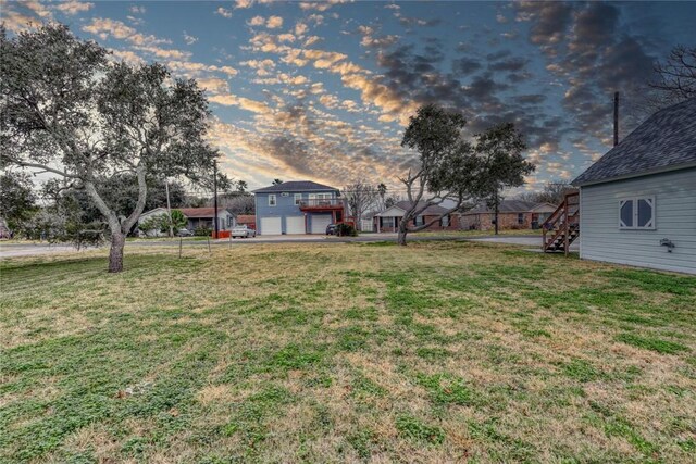 4034 Laguna Shores Rd, Corpus Christi, TX 78418 - yard at dusk with stairway