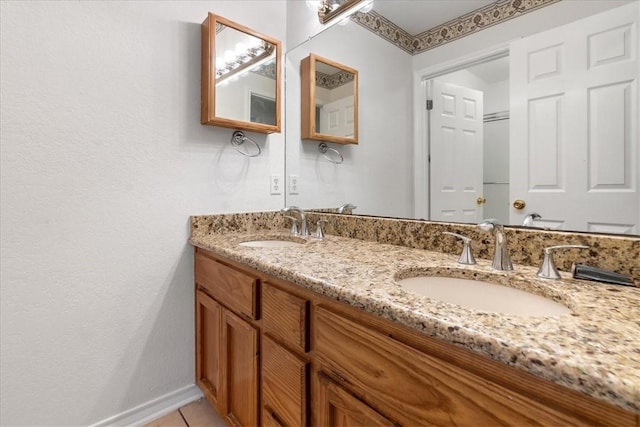 bathroom with tile patterned floors and vanity