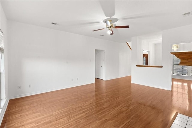 unfurnished living room featuring light hardwood / wood-style flooring and ceiling fan