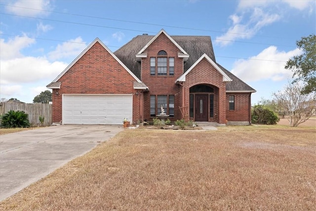 view of front property featuring a front yard and a garage