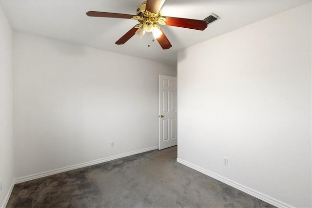 spare room with dark colored carpet and ceiling fan