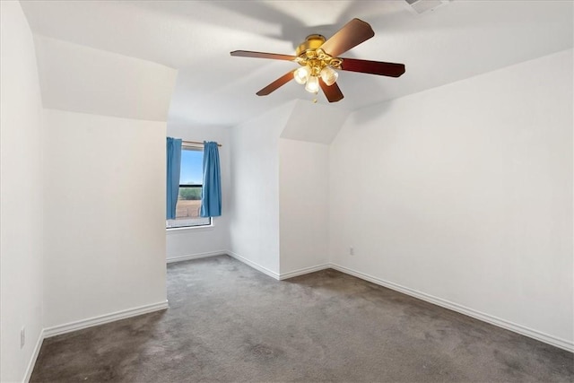 carpeted empty room with ceiling fan and lofted ceiling