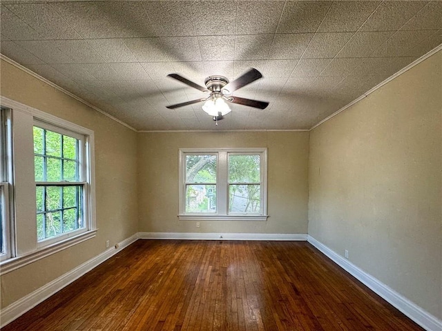 spare room with ceiling fan, dark hardwood / wood-style floors, and ornamental molding