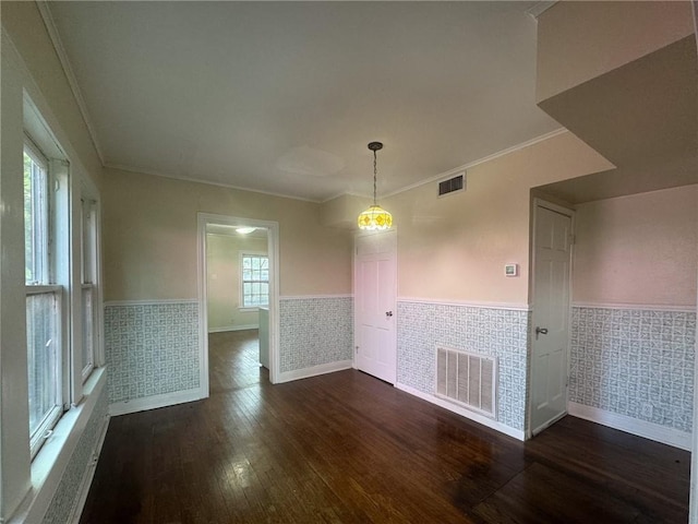 unfurnished room featuring crown molding and dark hardwood / wood-style floors