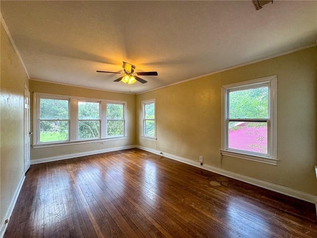 unfurnished room with ceiling fan, crown molding, and dark hardwood / wood-style floors