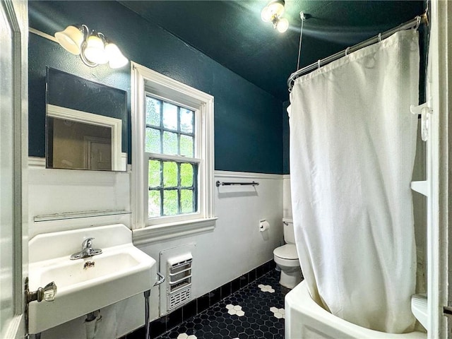 bathroom with sink, tile patterned flooring, and toilet