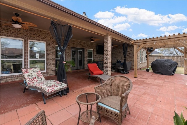 view of patio / terrace featuring ceiling fan, area for grilling, a pergola, and french doors