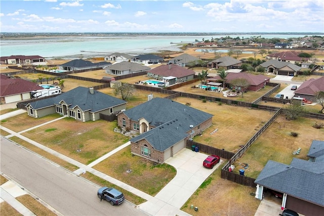 drone / aerial view featuring a water view