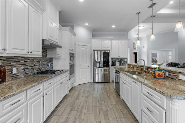 kitchen featuring white cabinetry, sink, pendant lighting, and stainless steel appliances