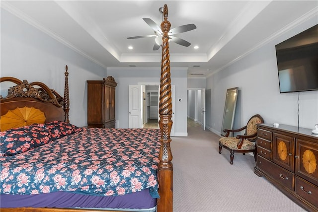 bedroom featuring crown molding, ceiling fan, a raised ceiling, and light colored carpet