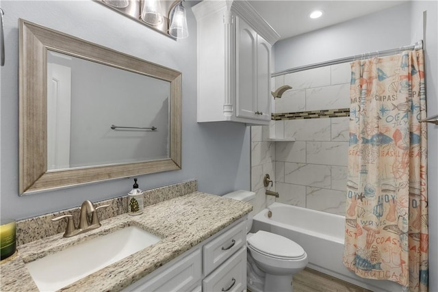 full bathroom featuring vanity, shower / bathtub combination with curtain, and toilet