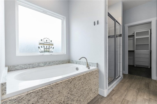 bathroom featuring plus walk in shower